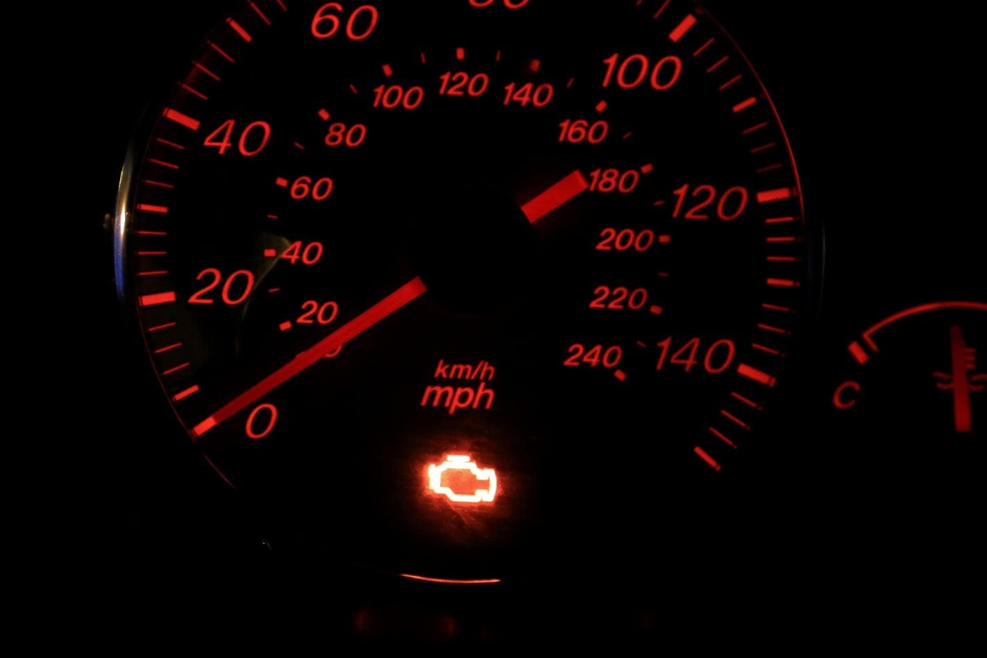 Check engine light illuminated on a dashboard